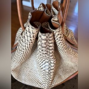 Nice Brahmin shoulder bag. Slight wear. A few ink stains inside bottom.